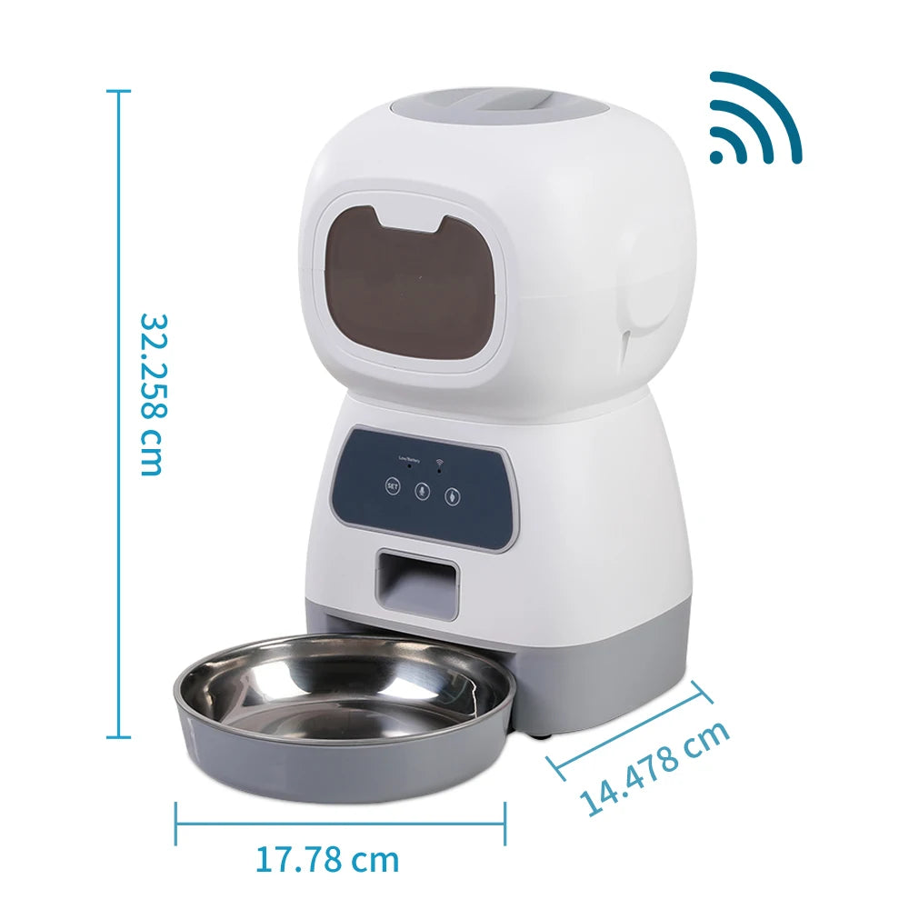 Automatic pet feeder for cats with LCD display and smartphone control, accompanied by a relaxed cat.