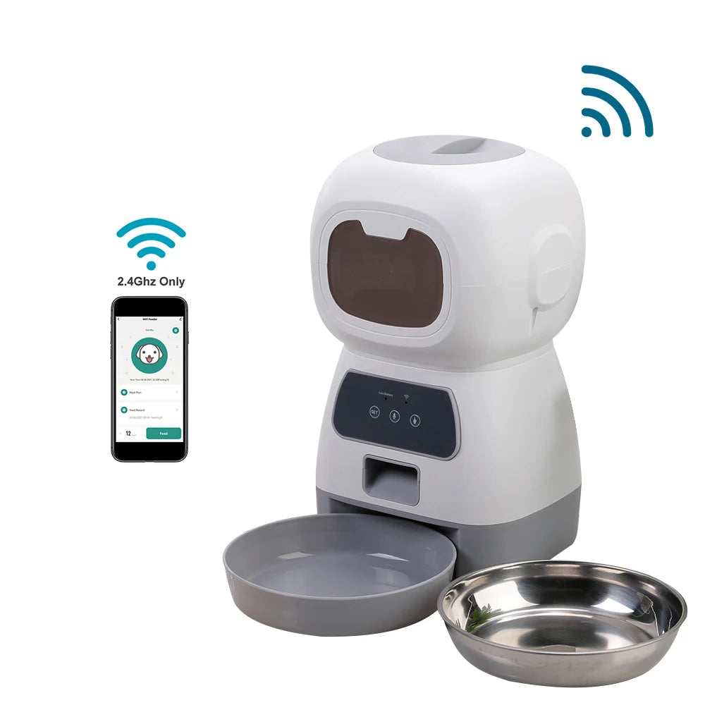 Automatic pet feeder for cats with LCD display and smartphone control, accompanied by a relaxed cat.