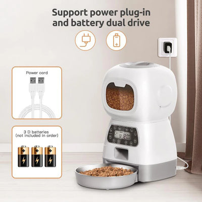 Automatic pet feeder for cats with LCD display and smartphone control, accompanied by a relaxed cat.