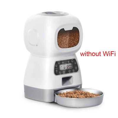 Automatic pet feeder for cats with LCD display and smartphone control, accompanied by a relaxed cat.